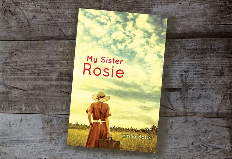A book cover with an image of a woman in a straw hat.