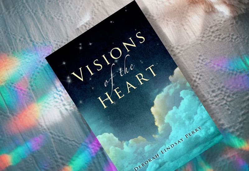 A book cover with the title of visions of the heart.