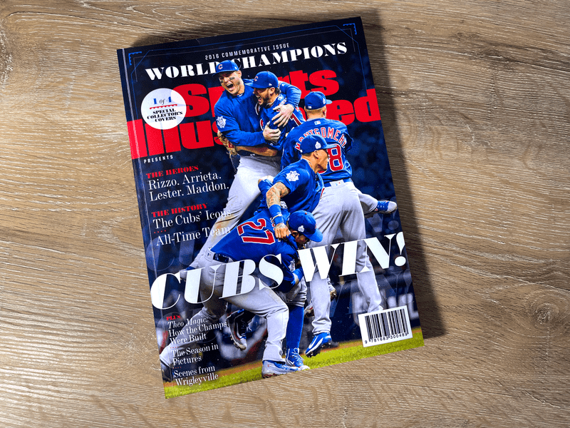 A cubs magazine cover with the world series champions.