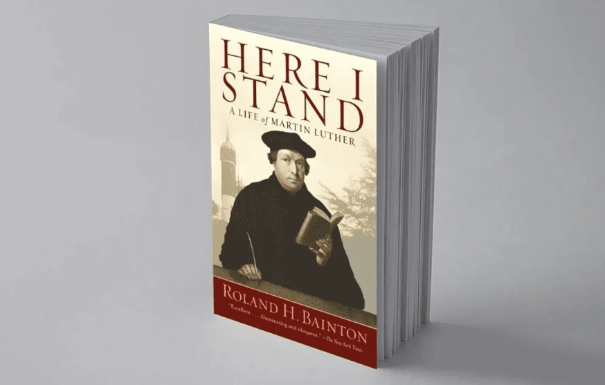 A book cover with an image of a man holding a book.