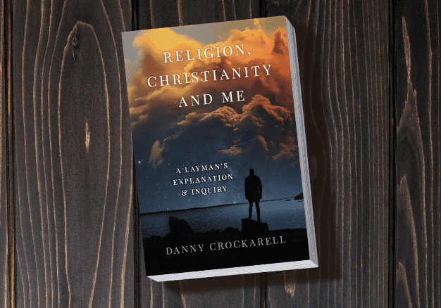 A book cover with a person standing on top of it.